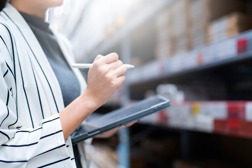 close-up-female-business-owner-hand-hold-tablet-device-checking-inventory-stock-shop-warehouse-distributor-factory-business-ideas-concept